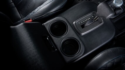 Cup holders and gear selector