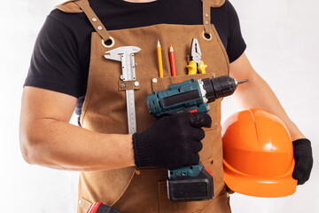 Handyman with Power Drill and Safety Gear