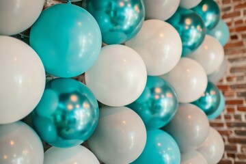 Close up photo of a birthday party s white photo zone with turquoise and gray balloons at a restaurant