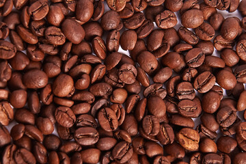 Coffee beans on white background. Texture background. Roasted Arabica beans