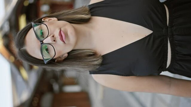 Beautiful latin brunette donning glasses, serious gaze fixated on fushimi inari-taisha shrine, kyoto. hispano-japanese moment captured, female reflects with sad confidence, japan temple.