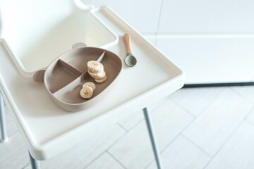 Bananas on a plate, baby's first feeding