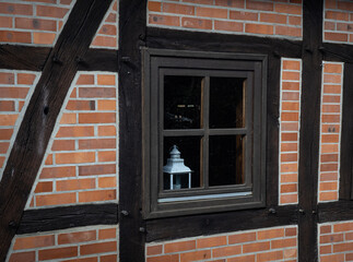 Window of timber framing  brick wall.