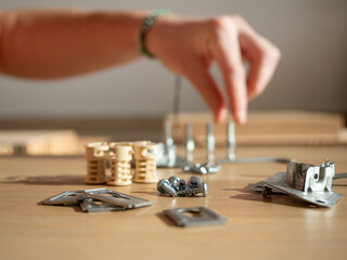Hand Selecting Screws for Furniture Assembly Task