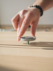 Hand Tightening Leg Support to Cabinet Bottom