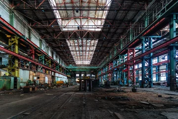 Rolgordijnen Abandoned factory. Large empty ruined industrial hall © Mulderphoto