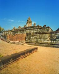 Stone walls and tower of the Bakong temple, Roulos, Cambodia