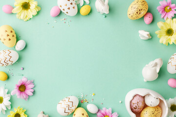 Springtime Easter: a cascade of colors and sweet traditions. Top view of Easter eggs, some in a...