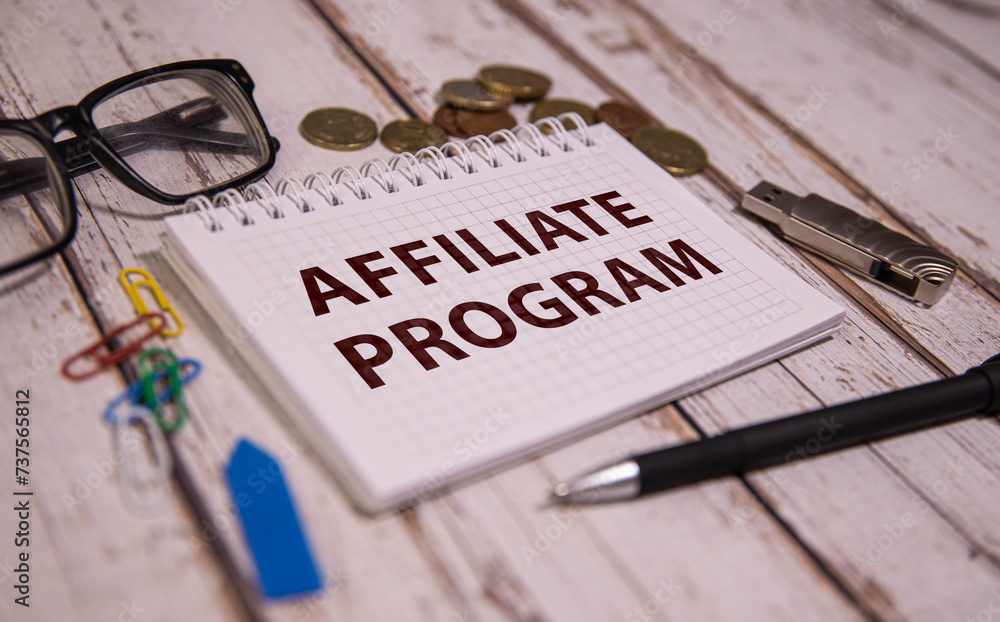 Poster affiliate program text on notepad, concept background