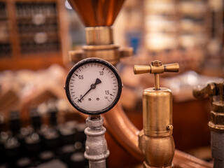 barometer at copper distillery still - obrazy, fototapety, plakaty
