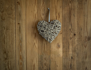 Wooden heart symbol  on  wooden wall