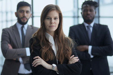 Successful diverse business team, three workers looking at camera