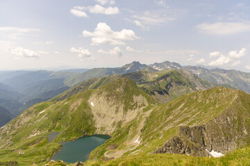 Hiking trail in the high mountain., with sharp rocks next to the trail.