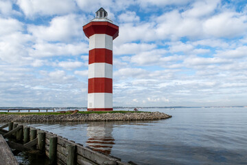 Lighthouse on Lake Conroe with clouds in background