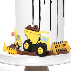 Birthday cake with constructions site decor, cars, crane and excavator