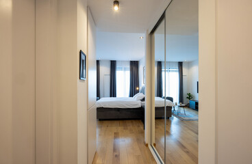 Modern apartment interior with large mirrors