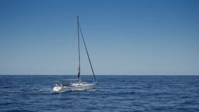 White yacht ship boats with a sail on regata voyage trip in the blue sea