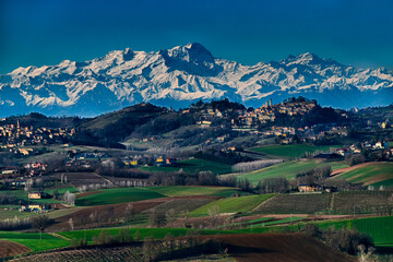 Fototapeta na wymiar A postcard from Monferrato with a view of the snow-capped Alps - Camagna - Alessandria - Piedmont - Italy
