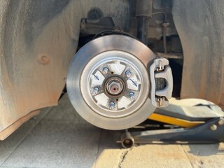 An electric vehicle inspection involves checking brake pads and disc brakes for malfunctions,...