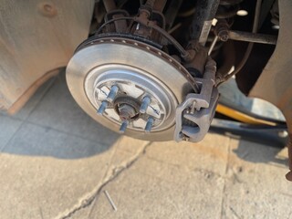 An electric vehicle inspection involves checking brake pads and disc brakes for malfunctions,...