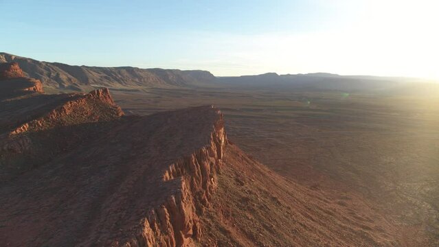 Aerial circle around red cliff with sunset in beautiful St George Utah desert