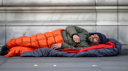 Foto op Canvas Homeless people sleeping in sleeping bag and cardboard in a street, concept of financial crisis, unemployment, lose job, vulnerable groups. © Jasper W