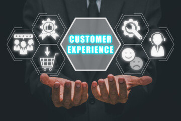 Customer experience concept, Businessman hand holding customer experience icon on virtual screen.