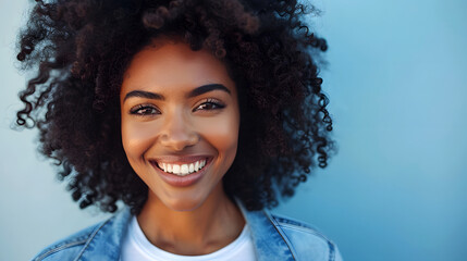 Joyful Radiance: Confident Woman with Curly Afro in Casual Denim