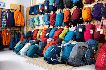 On wall and floor there is showcase with backpack for travelers and tourists - for climbing and...
