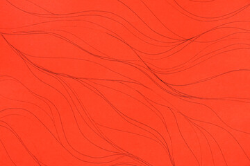 Closeup view of abstract wavy lines on red background