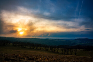 Obraz premium sunset foggy, cloudy, landscape, rhön, germany