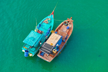 Fototapeta na wymiar Aerial view from the cable car to the national Vietnamese wooden fishing boats on sea An Thoi harbor. Phu Quoc island, Vietnam.