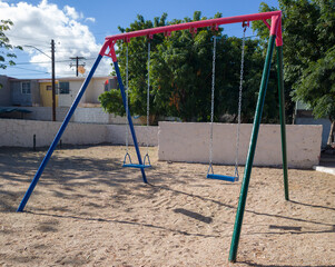 Two seat swing in a public park