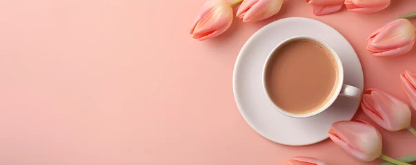 Fotobehang Morning coffee cup with bouquet of pink tulips on light red background. Hot drink with spring flowers. Romantic breakfast for Women's or Valentine day. Flat lay, top view with copy space © ratatosk