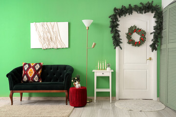 Interior of room with beautiful Christmas mistletoe wreath