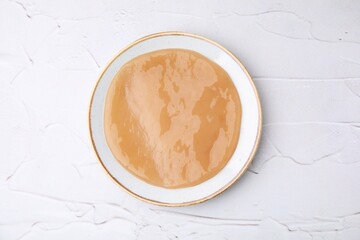Making kombucha. Scoby fungus on white textured table, top view