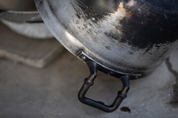 Stainless steel pot for boiling water in the kitchen, selective focus