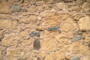old stone on the wall of an old church as a background 2