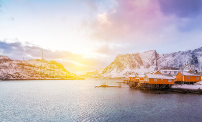 norway lofoten beach red houses clouds in the air sunset light and colors