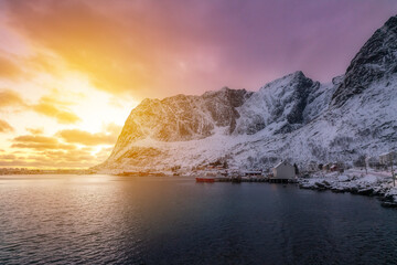 norway lofoten beach red houses clouds in the air sunset light and colors