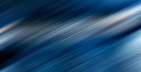 abstract blue background with some diagonal stripes and some blur in it