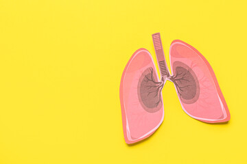Paper lungs on yellow background