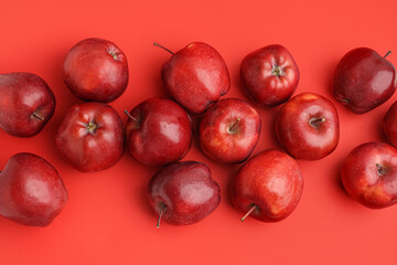 Many fresh red apples on color background