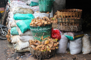 pile of old coconut shells in a basket