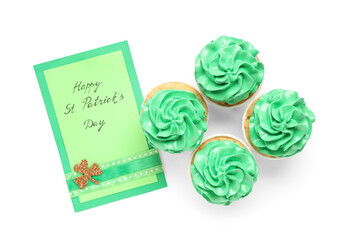Tasty green cupcakes with festive postcard for St. Patrick's Day on white background