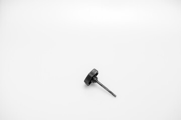 Studio shot of a well worn rusty plastic knob isolated against a white background 