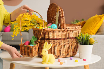 Woman with Easter baskets at home, closeup - obrazy, fototapety, plakaty