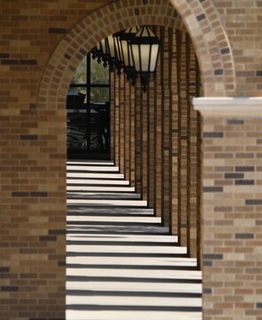 Outdoor breezeway with hanging lamps