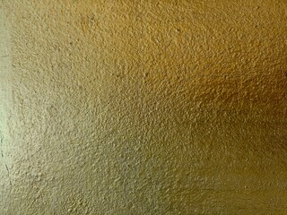 Gold cement wall texture background 