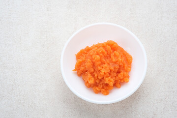 Organic carrots pulp juice, squeezed from a slow juicer, for face mask or processed into smoothie,...
